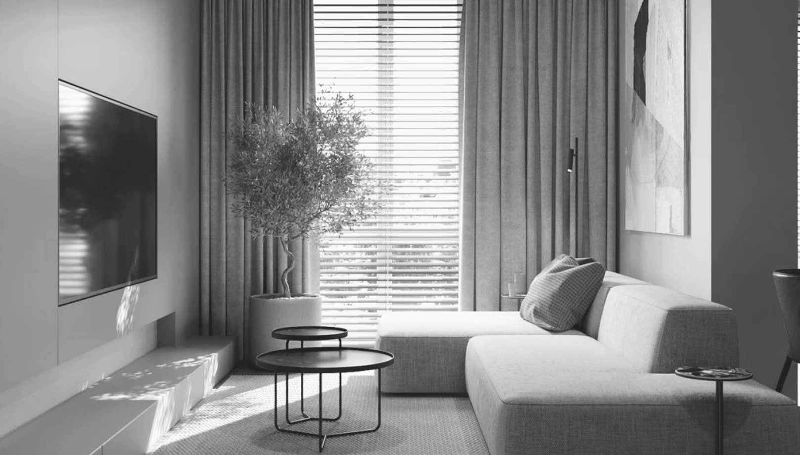 A living room with a sofa and tall window.